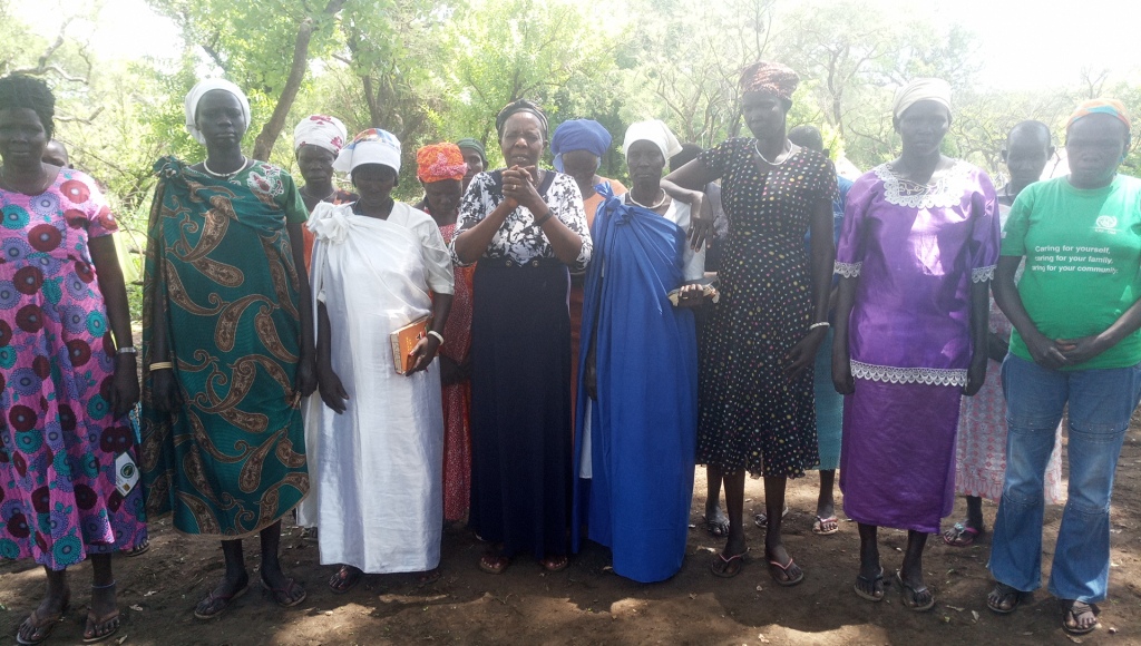 Mrs Simporoza Otim praying together with south sudanese women